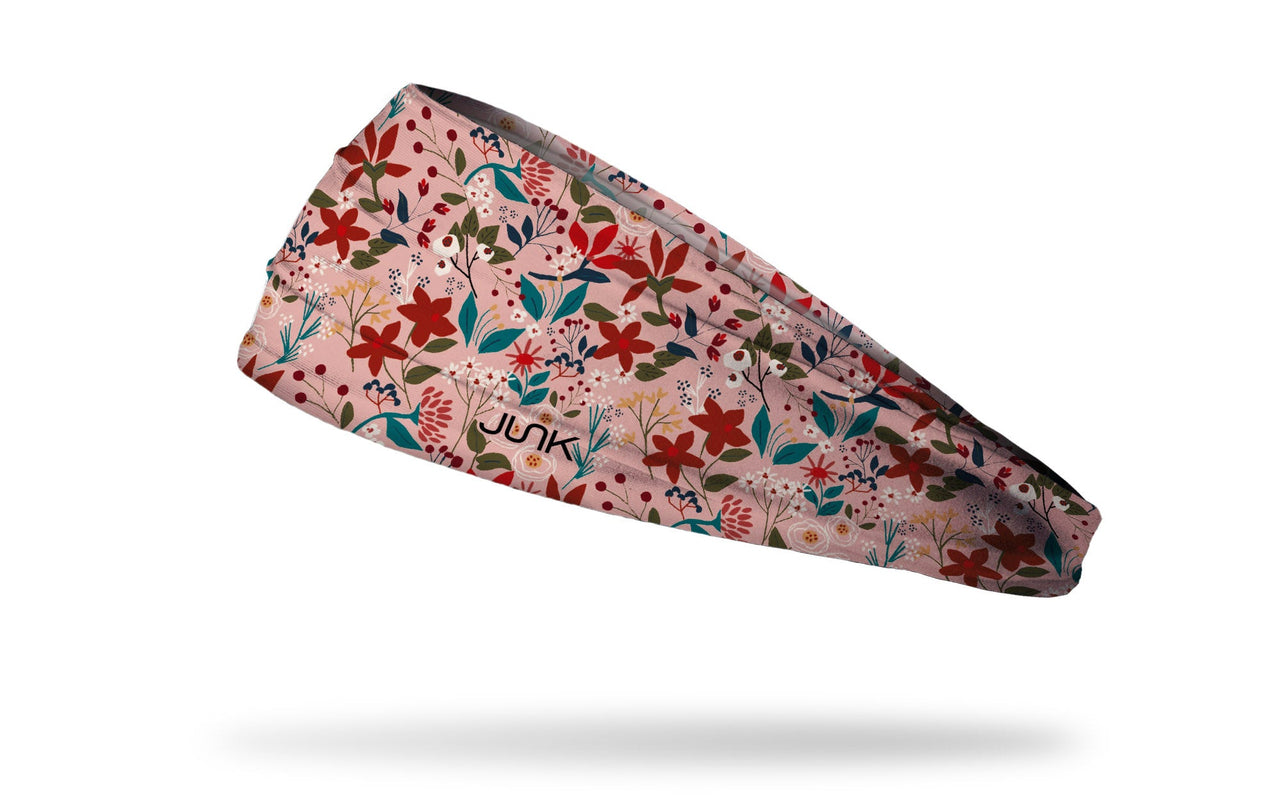 light pink headband with repeating pattern of different kinds of bright wildflowers
